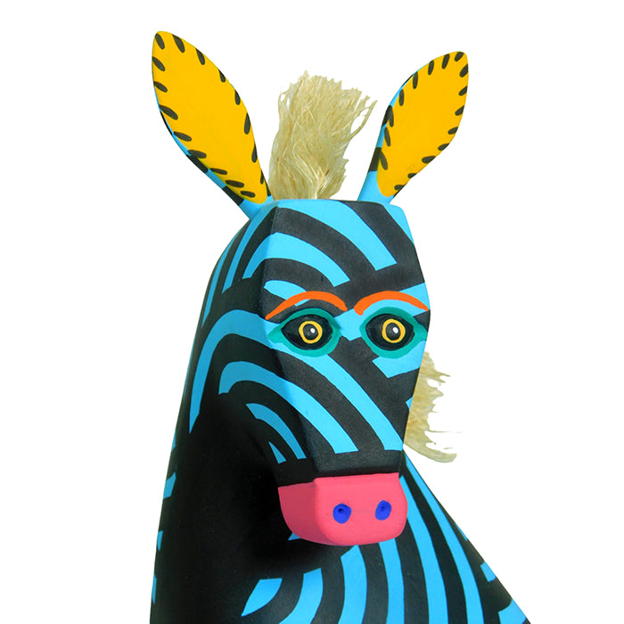 Oaxaca woodcarving alebrije featuring a blue zebra